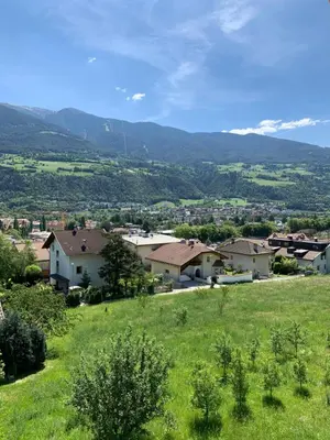 a view of a village with mountains in the background at Castell Matscher in Bressanone
