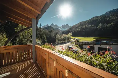 a balcony with a view of the mountains at Hotel Ranuimüllerhof in Villnoss