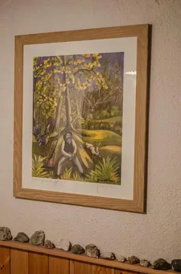a painting of a monkey hanging on a wall at Casa Soraya in Falcade