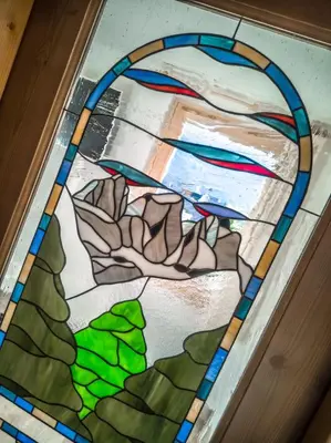 a stained glass window on a door at Casa Soraya in Falcade