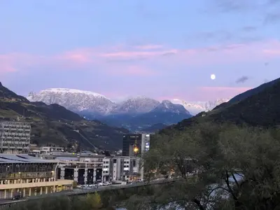 a city with snow capped mountains in the background at Bozen - voll ausgestattet, optimale Lage in Bolzano