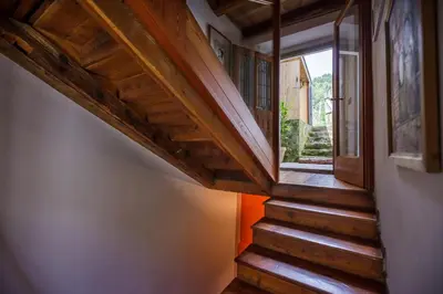 a staircase in a house with a window at LA PITA AGORDINA in Cancellade