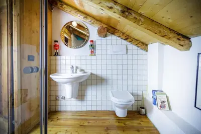 a bathroom with a sink and a toilet at LA PITA AGORDINA in Cancellade