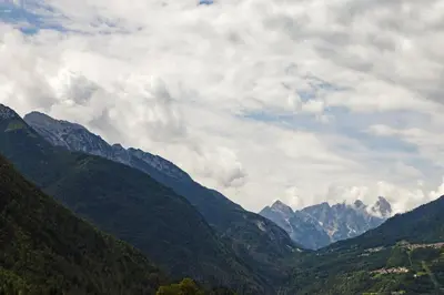 a view of a mountain range on a cloudy day at LA PITA AGORDINA in Cancellade