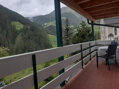 a balcony of a house with a view of the mountains at Alpen Ferienwohnung Ill in Lappago