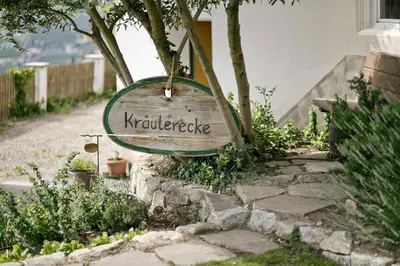 a sign that reads murderride hanging from a house at Perlhof in Schenna