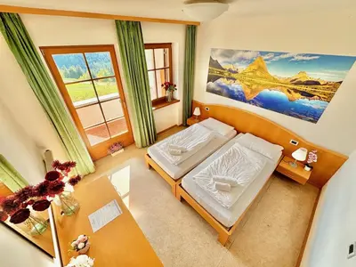an overhead view of a bedroom with two beds at Hotel Corno Bianco in Nova Ponente