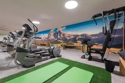 a gym with a mountain mural on the wall at Zum Alten Moar in Bressanone