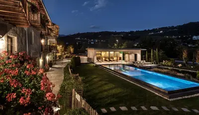 a house with a swimming pool in a yard at Zum Alten Moar in Bressanone