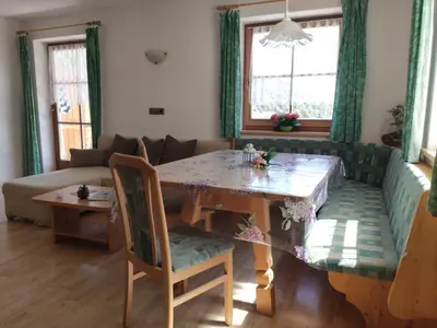 a living room with a table and a couch at Obkirchhof in Unsere Liebe Frau im Walde