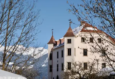 a castle in the mountains with snow at Castel Maurn Dolomites in San Lorenzo di Sebato