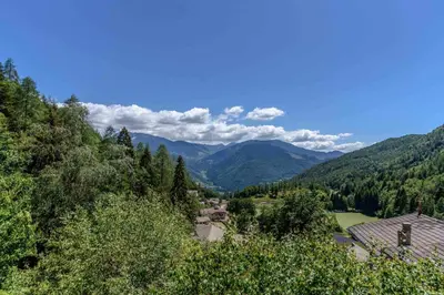 a view of a valley with mountains and trees at Al Faggio Ponciach Altavalle OSPITAR in Sover