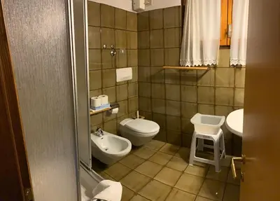 a kitchen with a bed in a room at Residence Trunka Lunka in Cavalese