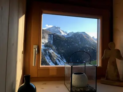 a window with a view of a mountain view at Cherz Romantic House in Arabba