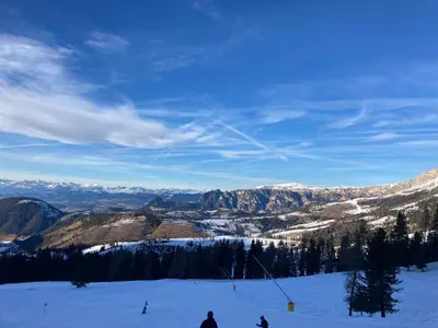 a group of people skiing down a snow covered slope at Renoviertes Apartment mit Terrasse an der Piste mit kostenlosen WiFi in Carezza al Lago
