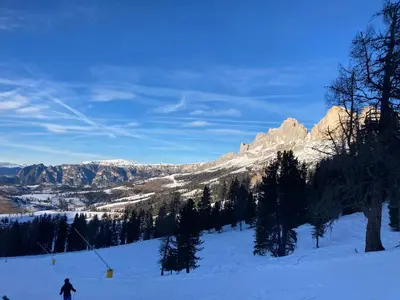 a person is skiing down a snow covered mountain at Renoviertes Apartment mit Terrasse an der Piste mit kostenlosen WiFi in Carezza al Lago