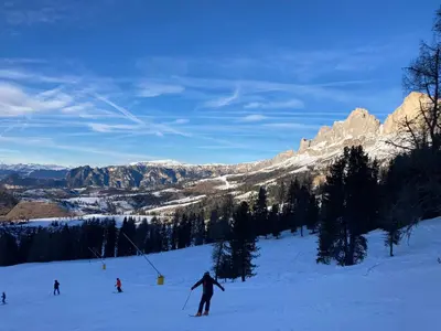 a group of people skiing down a snow covered slope at Renoviertes Apartment mit Terrasse an der Piste mit kostenlosen WiFi in Carezza al Lago