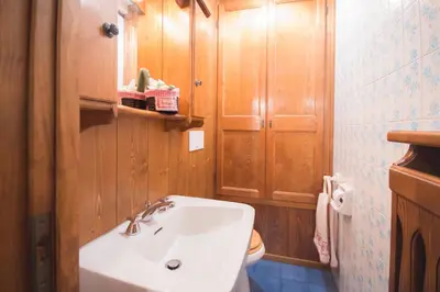a bathroom with a sink and a toilet at Casa vacanze 5 Torri in Cortina dʼAmpezzo