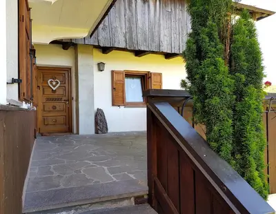 a entrance to a house with a wooden fence at Casa sulle nuvole in Montesover