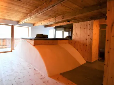 a room with a ramp in a building with wooden walls at Haidnerhof in Bressanone