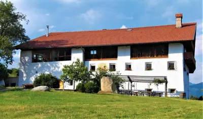 a large white building with a red roof at Haidnerhof in Bressanone