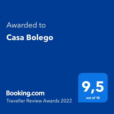 a screenshot of a cell phone with the text awarded to casa bologico at Casa Bolego in Cagnò
