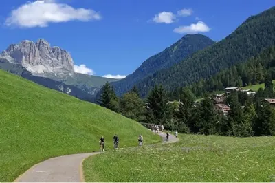 a group of people walking down a road at Dolomiti Terrace Cavalese in Cavalese