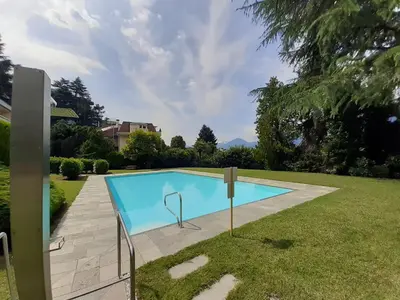 a swimming pool in the backyard of a house at Appartement Pienzenau in Merano