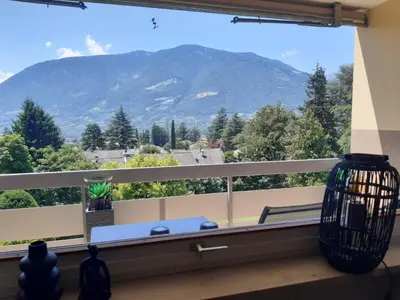 a window with a view of a mountain at Appartement Pienzenau in Merano
