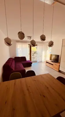a living room with a table and a couch at Appartement Nadia in Bressanone