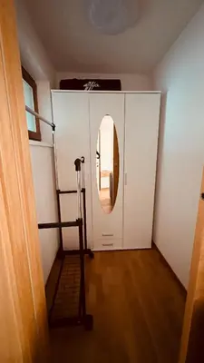 a room with a mirror and a shelf in a room at Appartement Nadia in Bressanone