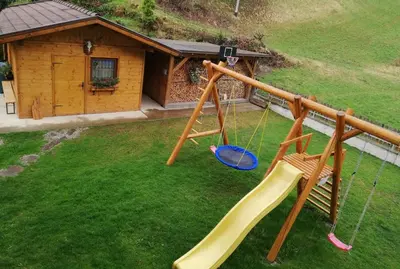 an aerial view of a playground with a swing at Pramstaller Apartments in San Lorenzo di Sebato
