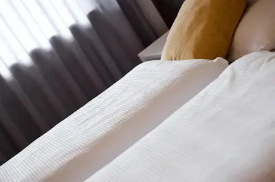 a close up of the edge of a bed at Apartment Steinach in Lagundo