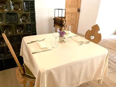a dining room with two tables in a room with at Rifugio Ospitale in Cortina dʼAmpezzo