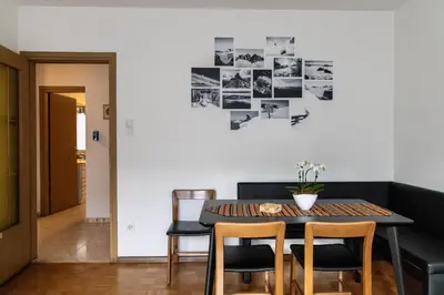 a dining room with a table and chairs at Casa Adriana in Bressanone