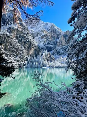 a view of a mountain lake with snow on it at Apartment Lukas Huber in Brunico