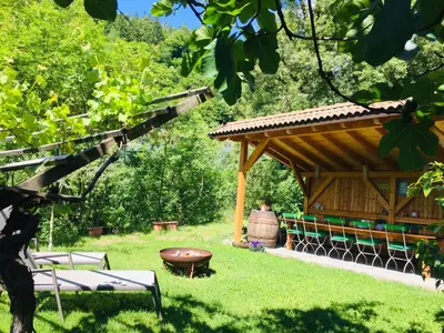 a pavilion in a park with a bench and a table at Tannerhof Bed & Breakfast in Caines