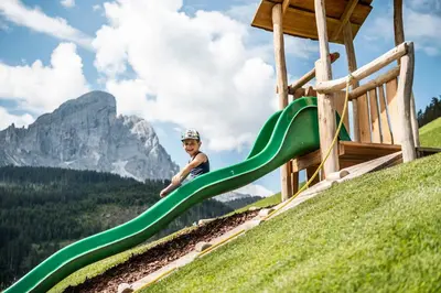 a snow covered mountain with a ski lodge on a ski slope at La Majun Fornellahof in Antermoia