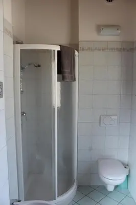 a bathroom with a shower and a toilet at Agritur Fiore in Fondo