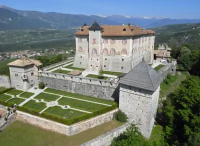 an aerial view of a castle in the mountains at Appartamento Rosina, per 4/6 persone. In centro in Coredo