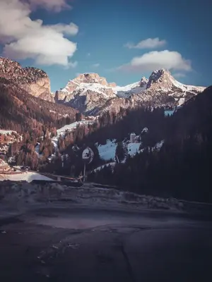 a view of a mountain range with snow capped mountains at Pension Dolomieu in Santa Cristina in Val Gardena