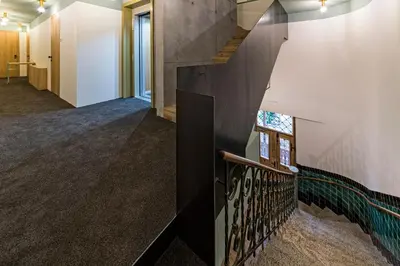 a staircase in a house with a window at Hotel Villa Mayr Rooms & Suites in Brixen