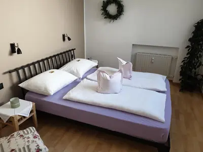 two beds with pillows on them in a room at viaDolceVita - Blaue Gästewohnung in Lana