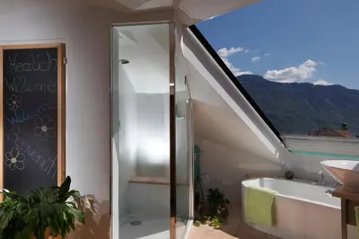 a bathroom with a shower and a tub and a sink at viaDolceVita - Blaue Gästewohnung in Lana