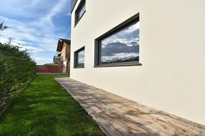 a house with a window on the side of it at Casa Alpina in Cavalese