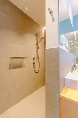 a bathroom with a shower and a sink at La Villetta 17 - smarter Rückzugsort für die großen Winter-Wettkämpfe in Lana