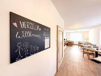 a chalkboard on the wall of a classroom at Strengen Guesthouse in Caldaro