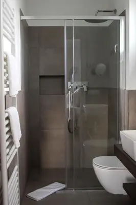 a bathroom with a shower with a toilet and a sink at CasaLuNa in Appiano sulla Strada del Vino