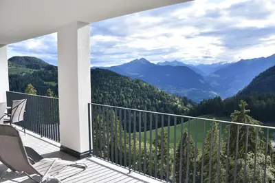 a balcony with a view of mountains at Panoramaresidence Hafling in Avelengo
