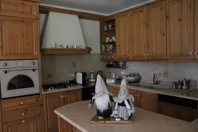two gnomes are sitting on a kitchen counter at Apartment El Cor in Taibon